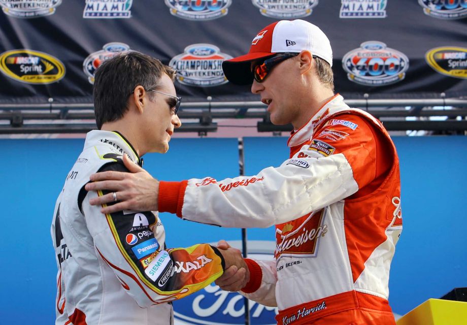 Jeff Gordon left and Kevin Harvick shake hands during the driver introductions for the NASCAR Sprint Cup Series auto race Sunday Nov. 22 2015 at Homestead Miami Speedway in Homestead Fla