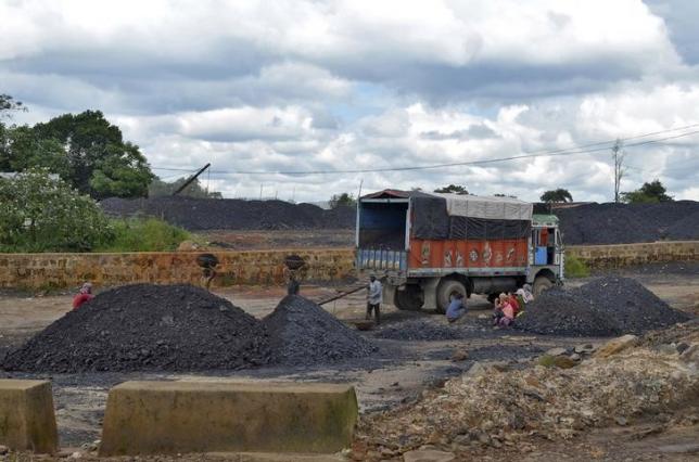 Labourers work at a coal stockyard in East Jaintia Hills in Meghalaya