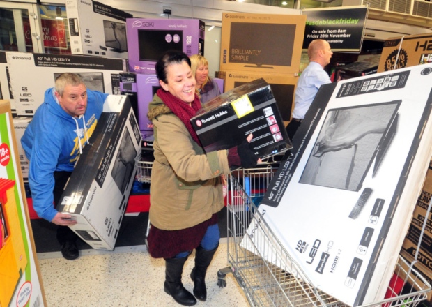 Shoppers grabbing Black Friday bargains at Asda Pudsey in November 2014