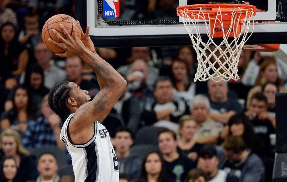 San Antonio Spurs forward Kawhi Leonard shoots during the first half of an NBA basketball game against the Dallas Mavericks Wednesday Nov. 25 2015 in San Antonio