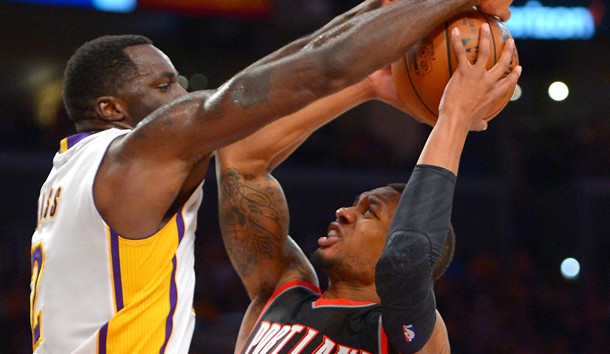 Nov 22 2015 Los Angeles CA USA Los Angeles Lakers forward Brandon Bass guards Portland Trail Blazers guard Damian Lillard in the second half of the game at Staples Center. Mandatory Credit Jayne Kamin-Oncea-USA TODAY Sports