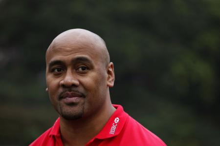 New Zealand's rugby legend Jonah Lomu looks on during a coaching tour in Hong Kong