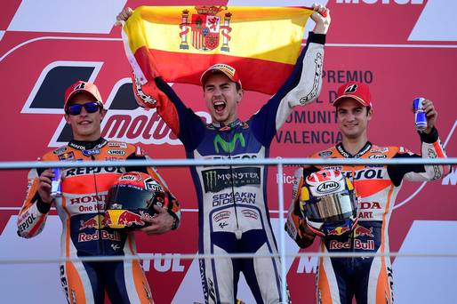 Champion Jorge Lorenzo celebrating after winning in Valencia and becoming MotoGP world champion is joined on the podium by Marc Marquez and Dani Pedrosa