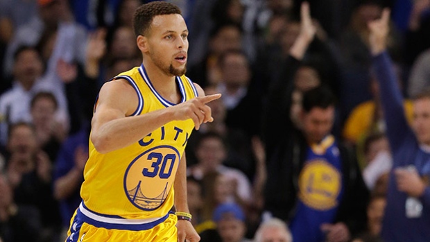 Golden State Warriors guard Stephen Curry reacts after making a 3-point basket during the first half against the Los Angeles Lakers in Oakland Calif. on Tuesday