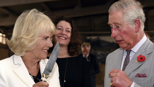 Britain's Prince Charles jokes with his wife Camilla Duchess of Cornwall during a visit to Seppeltsfield Winery in the Barossa Valley