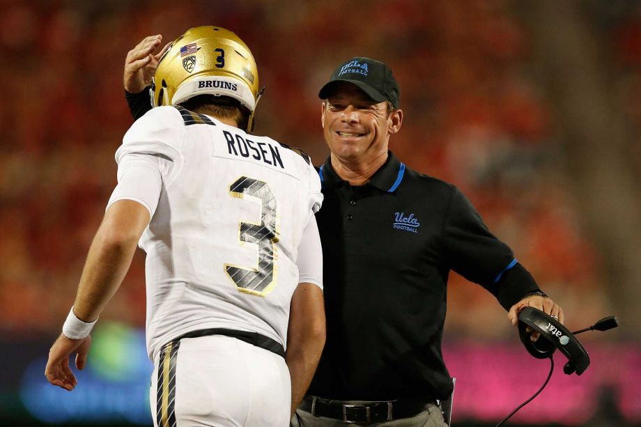 TUCSON AZ- SEPTEMBER 26 Head coach Jim Mora of the UCLA Bruins congratulates quarterback Josh Rosen #3 after Rosen scored on a eighth yard rushing touchdown against the Arizona Wildcats during the thrid quarter of the college football game at Arizona