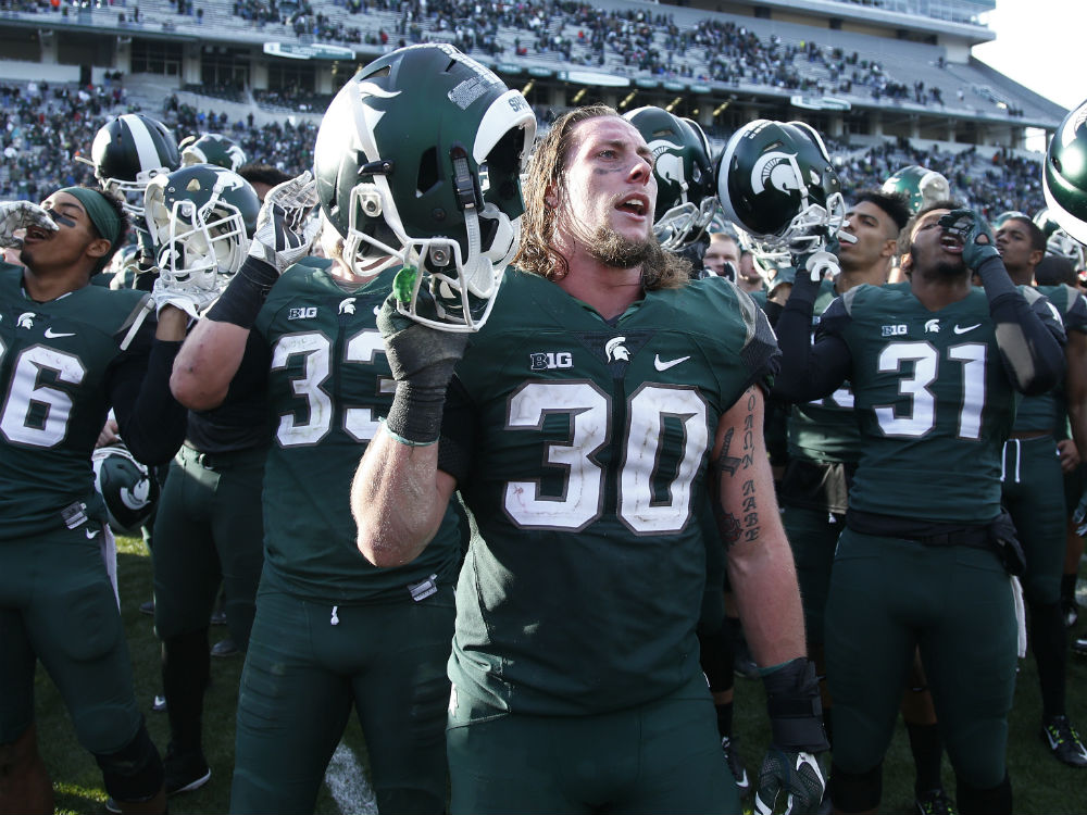 Michigan State Spartans players celebrate after the game against the Maryland Terrapins at Spartan Stadium