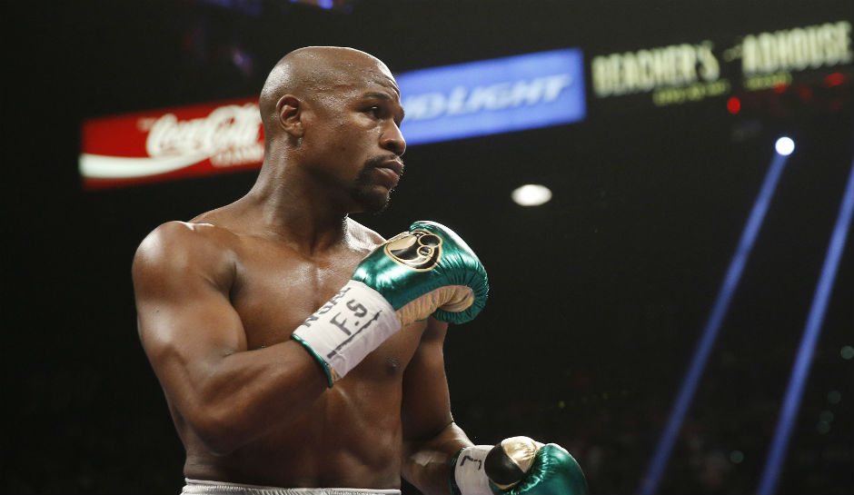 Floyd mayweather defends ronda rousey