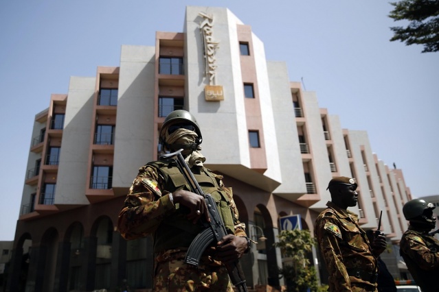 Tight security surrounds Malian President Ibrahim Boubacar Keita as he visits the Radisson Blu hotel in Bamako Mali Saturday