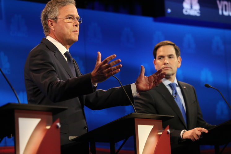 Sen. Marco Rubio and Jeb Bush left during the debate of Republican presidential hopefuls at the University of Colorado in Boulder Colo. on Oct. 28