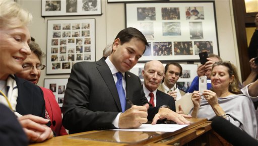 Republican presidential candidate Sen. Marco Rubio R-Fla. signs papers to be on the nation's earliest presidential primary ballot Thursday Nov. 5 2015 at The Secretary of State's office in Concord N.H