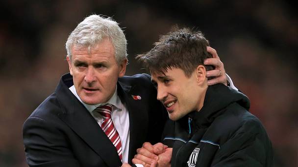 Mark Hughes left celebrates with Bojan Krkic after victory over Chelsea