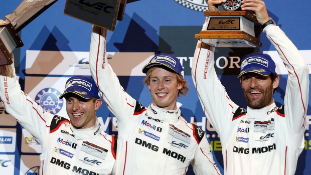 World champions from left Germany's Timo Bernhard New Zealand's Brendon Hartley and Australian Mark Webber celebrate winning the Texas round of the World Endurance Championship