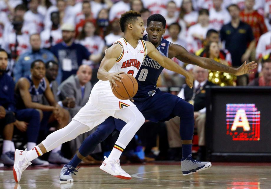 Maryland guard Melo Trimble left drives against Georgetown guard L.J. Peak in the first half of an NCAA college basketball game Tuesday Nov. 17 2015 in College Park Md