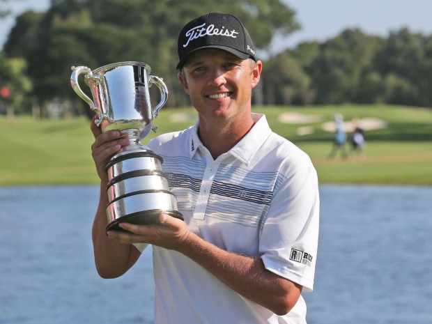 Matt Jones of Australia holds the Stone Haven Cup after winning the Australian Open in Sydney