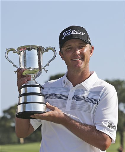 Matthew Jones of Australia holds the Stone Haven Cup after winning the Australian Open golf tournament in Sydney Sunday Nov. 29 2015