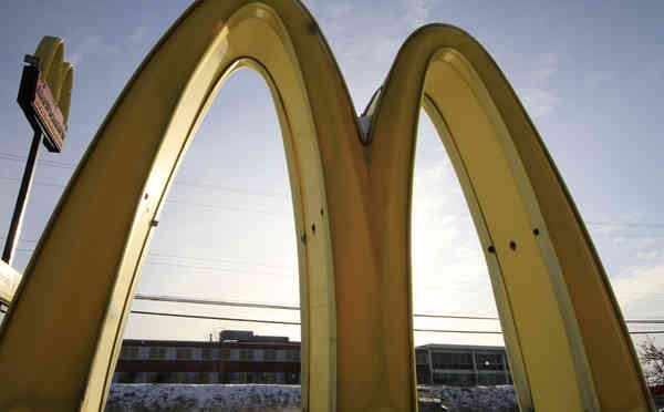 McDonald's says it will keep real-estate assets and increase its franchises as it pursues restructuring