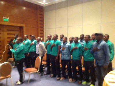 Members of Nigeria's Golden Eaglets listening to President Muhammdu Buhari during a live chat with the team via telephone Saturday