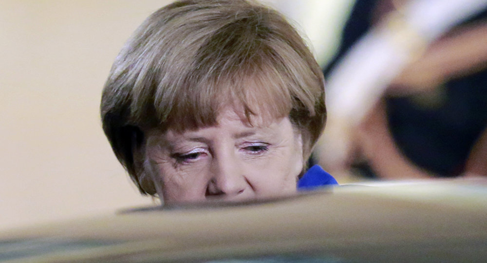 German Chancellor Angela Merkel leaves the Elysee Palace in Paris France after a a joint press conference with French President Francois Hollande Friday Oct. 2, 2015