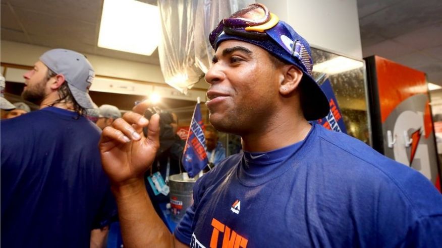 CHICAGO IL- OCTOBER 21 Yoenis Cespedes #52 of the New York Mets celebrates in the locker room with his teammates after defeating the Chicago Cubs in game four of the 2015 MLB National League Championship Series at Wrigley Field