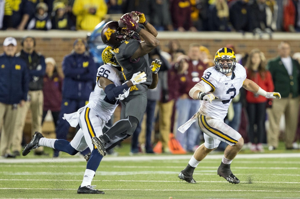 Oct 31 2015 Minneapolis MN USA Minnesota Golden Gophers wide receiver KJ Maye catches a pass as Michigan Wolverines cornerback Jourdan Lewis and linebacker Desmond Morgan play defense in the second half at TCF Bank Stadium. Michigan won