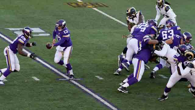 Quarterback Shaun Hill #13 of the Minnesota Vikings hands the ball off to teammate Adrian Peterson #28 during the fourth quarter of the game against the St. Louis Rams