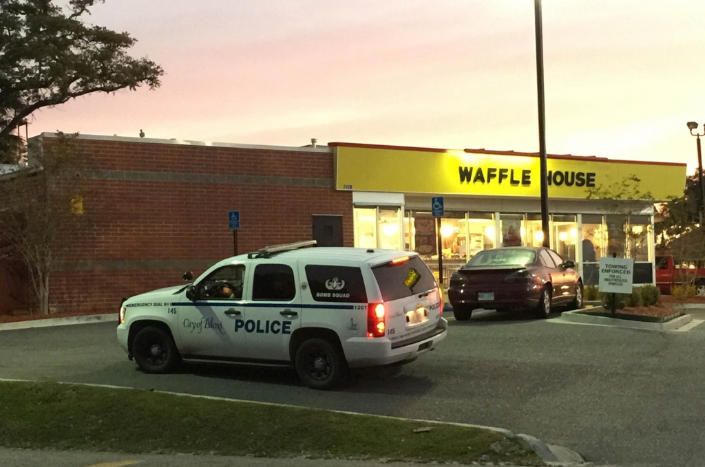 A police vehicle sits outside the Waffle House on U.S. 90 in Biloxi Miss. after a fatal shooting on Nov. 27 2015