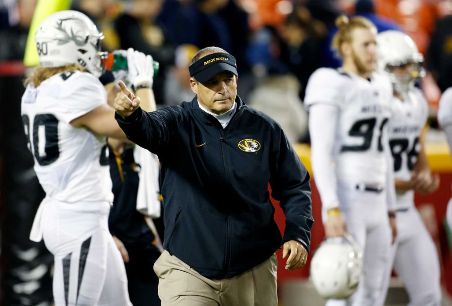 Missouri Tigers head coach Gary Pinkel gestures during warm ups before a college football game against BYU at Arrowhead Stadium Saturday Nov. 14 2015 in Kansas City Mo. Pinkel announced Friday he is stepping down at the end of the season after being