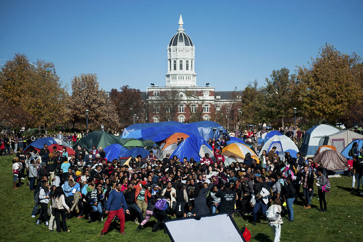 Supporters of Concerned Student 1950 celebrate following University of Missouri System President Tim Wolfe's resignation