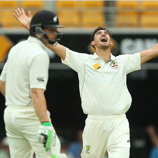 Mitchell Starc celebrates after dismissing Tom Latham