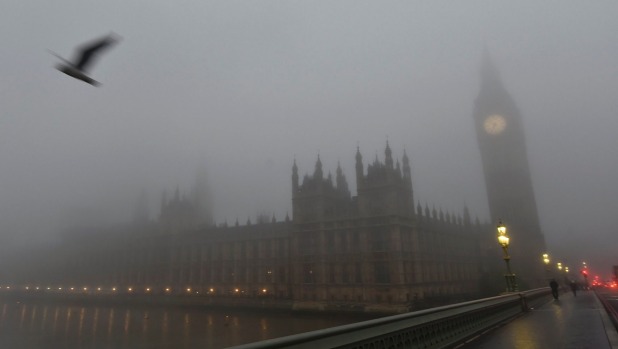 The Houses of Parliament are seen on a misty morning in London on November 2 which caused disruptions and flight cancellations at all London-area airports