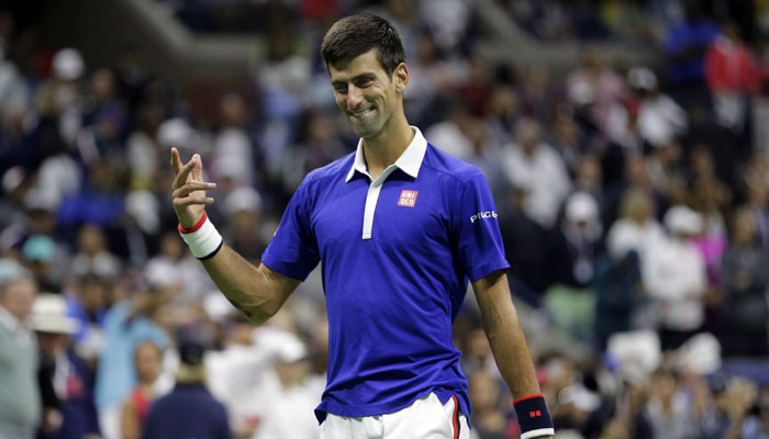 Novak Djokovic of Serbia returns the ball to Stanilas Wawrinka of Switzerland during their semifinal match of the BNP Masters tennis tournament at the Paris Bercy Arena in Paris France Saturday Nov. 7 2015