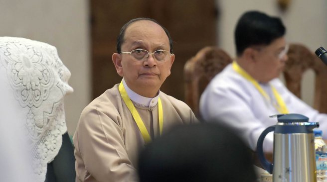 Myanmar's President Thein Sein listens to representatives of political parties at the Yangon Regional Government Office in Yangon