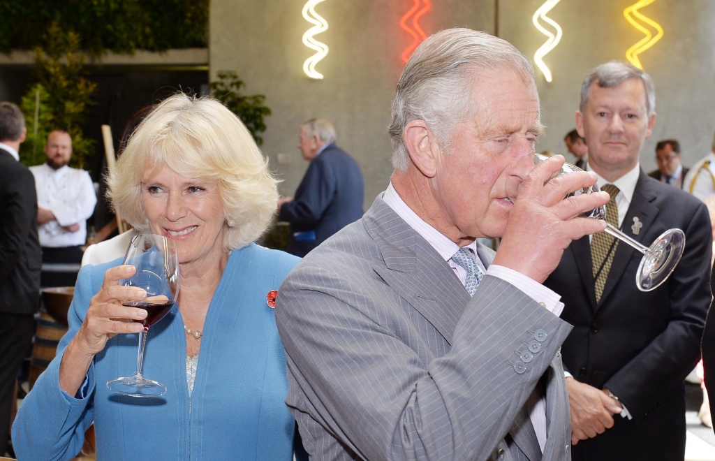 The Prince of Wales and Duchess of Cornwall sample organic red wine during a visit to the Mahana Winery in Nelson New Zealand