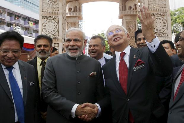 PM Narendra Modi and his Malaysian counterpart Najib Razak attend the opening of the Torana Gate a traditional gateway to Hindu and Buddhist temples in Kuala Lumpur