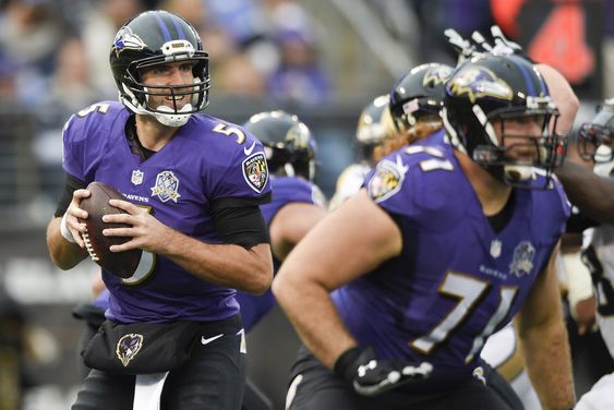 Joe Flacco turns out of the pocket looking for an open man during the second half of an NFL football game against the St. Louis Rams in Baltimore Sunday Nov. 22 2015. Flacco was injured in the closing minutes