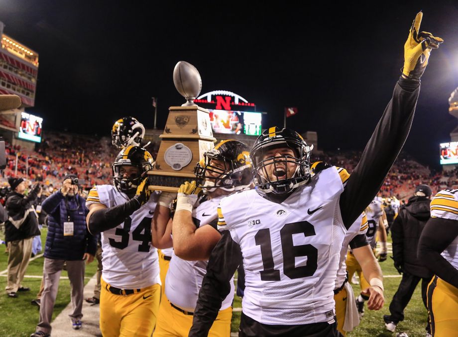 Iowa’s Nate Meier and Dillon Kidd show off the Heroes Trophy