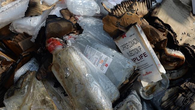 Burnt packages of medicine are seen in the back of a truck which was torched by protesters in Birgunj a Nepalese town bordering India