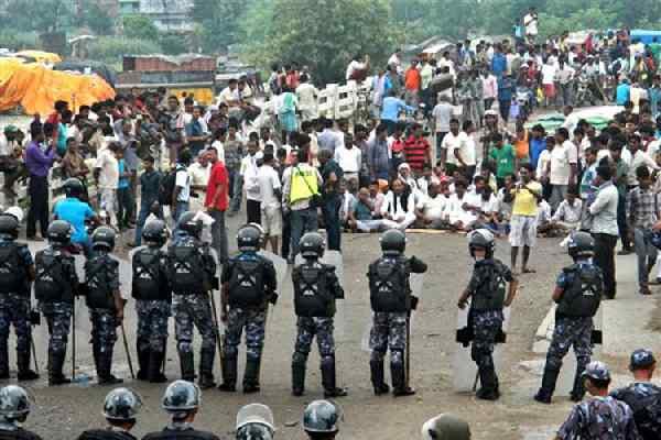 Nepal Police allegedly use batons on protestors blocking crucial bridge at Indo Nepal border