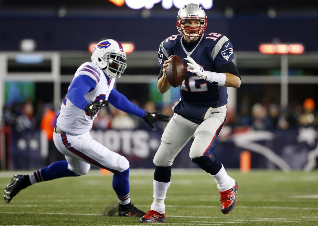 Nov 23 2015 Foxborough MA USA New England Patriots quarterback Tom Brady scrambles away from Buffalo Bills defensive end Mario Williams during the first half at Gillette Stadium. Mandatory Credit Winslow Townson-USA TODAY Sports