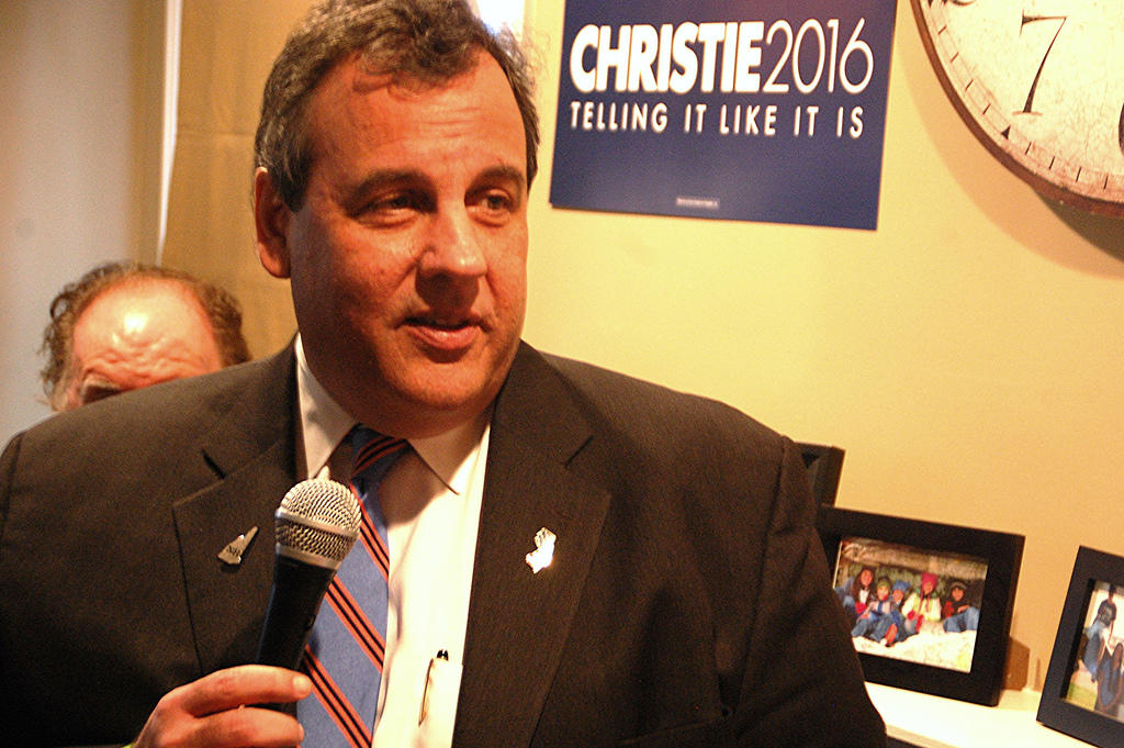 New Jersey Governor Chris Christie speaks at a house party in Bedford