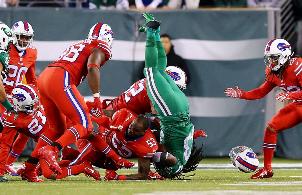 New York Jets running back Chris Ivory is tackled by Buffalo Bills defenders