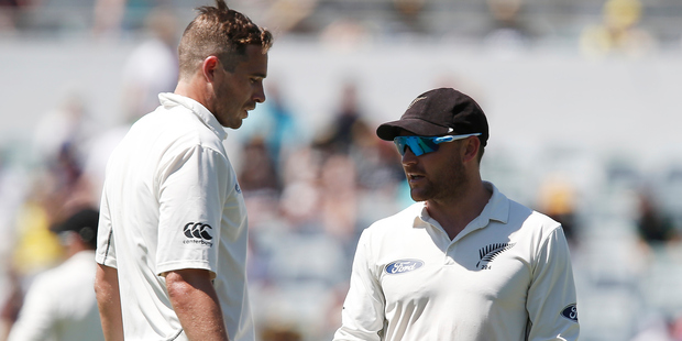 New Zealand's Captain Brendon McCullum right talks to team mate Tim Southee during their cricket test match against Australia in Perth