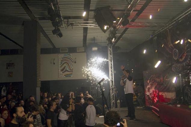 A member of the Romanian metal band'Goodbye to Gravity performs on the stage of a nightclub before a fire broke out Friday in Bucharest Romania