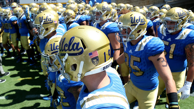 The Bruins take the field for the game with the Virginia Cavaliers at the Rose Bowl