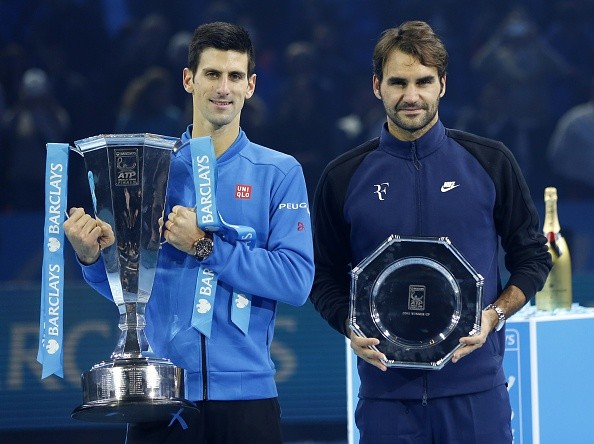 Novak Djokovic and Roger Federer with the winners and the runners-up trophy respectively on Sunday