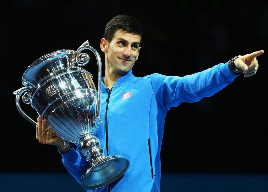 Novak Djokovic of Serbia receives the ATP World No 1 Award after his match against Kei Nishikori of Japan