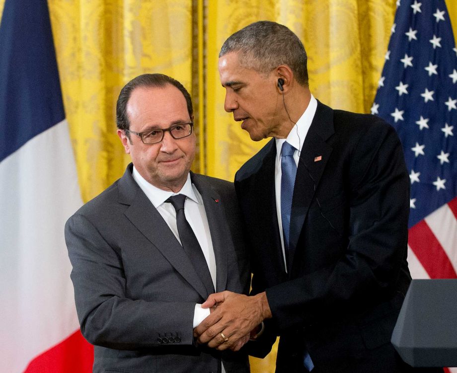 President Barack Obama shakes hands with French President Francois Hollande during their news conference in the East Room of the White House in Washington Tuesday Nov. 24 2015. Hollande's visit to Washington is part of a diplomatic offensive to get the