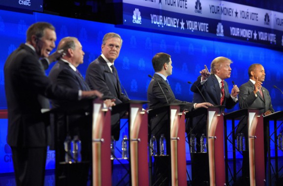 John Kasich left and Donald Trump second from right argue across fellow candidates during the CNBC Republican presidential debate at the University of Colorado