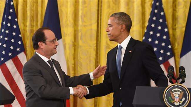 US President Barack Obama and French President Francois Hollande shake hands during a joint press conference at the White House in Washington DC